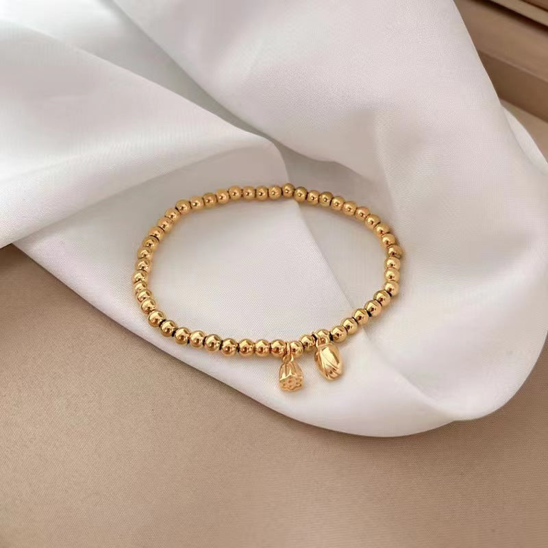 Grosir Gelang Manik Bunga Teratai Emas untuk Wanita – Baja Tahan Karat, Elegan, Anti Karat - 我的商店