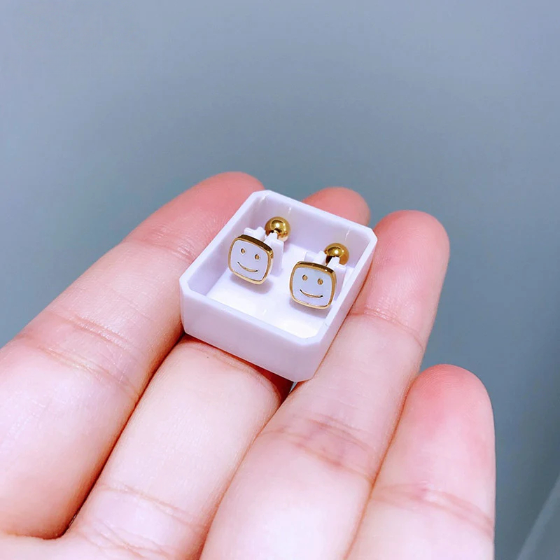 Anting Wajah Senyum Putih Baja Stainless perhiasandirect
