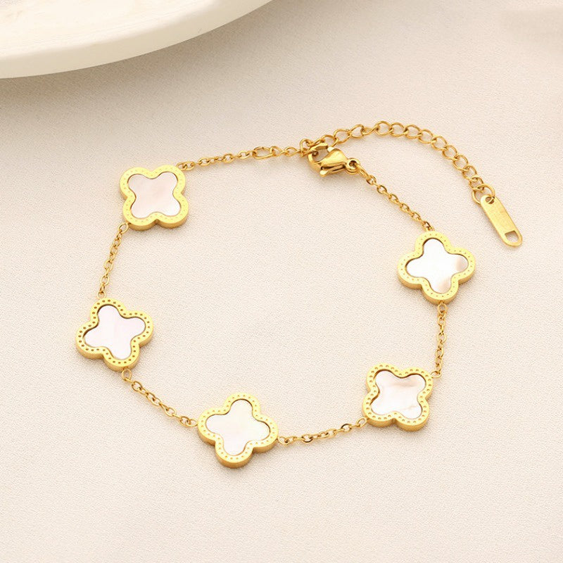 Gelang Four Leaf Clover untuk Wanita – white hitam Tampak depan, stainless steel warna emas