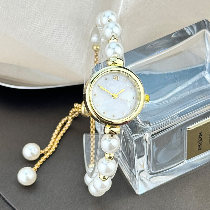 Jam tangan kuarsa wanita gelang mutiara dengan desain ceruk, ringan, mewah, dial kecil, dan dapat ditarik keluar10