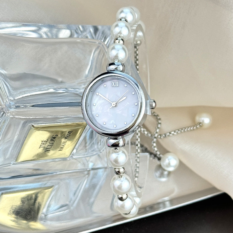 Jam tangan kuarsa wanita gelang mutiara dengan desain ceruk, ringan, mewah, dial kecil, dan dapat ditarik keluar9