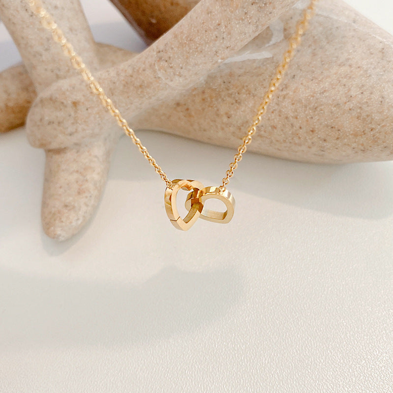 Kalung Titanium Double Heart – Desain Unik Double Ring, Gaya Kekinian perhiasandirect